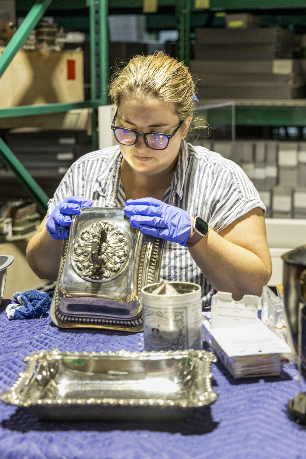 Lydia Blackmore examines a serving dish.