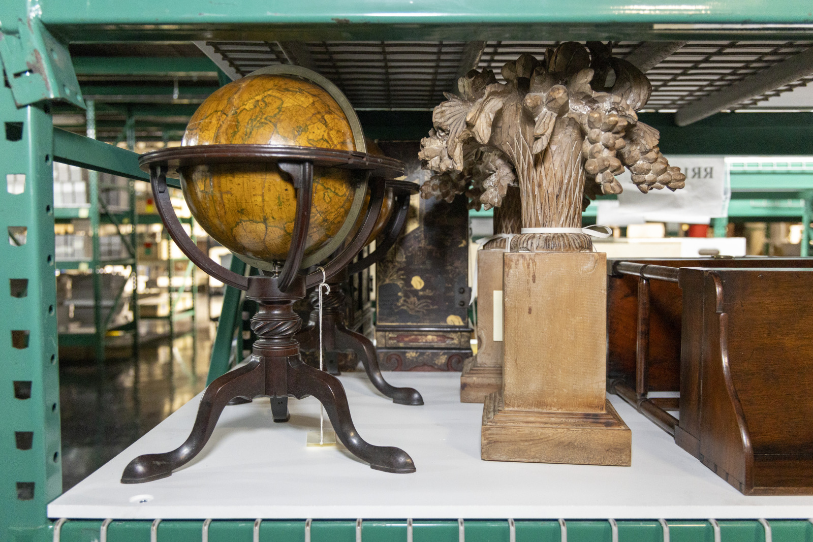 Williams furnishings currently in storage include a handsome globe and a carved fireplace ornament.