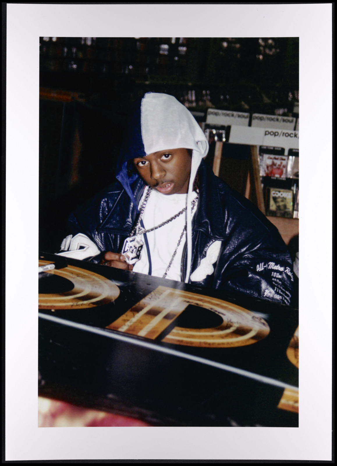 Lil Wayne behind a turntable at a club in the mid-1990s