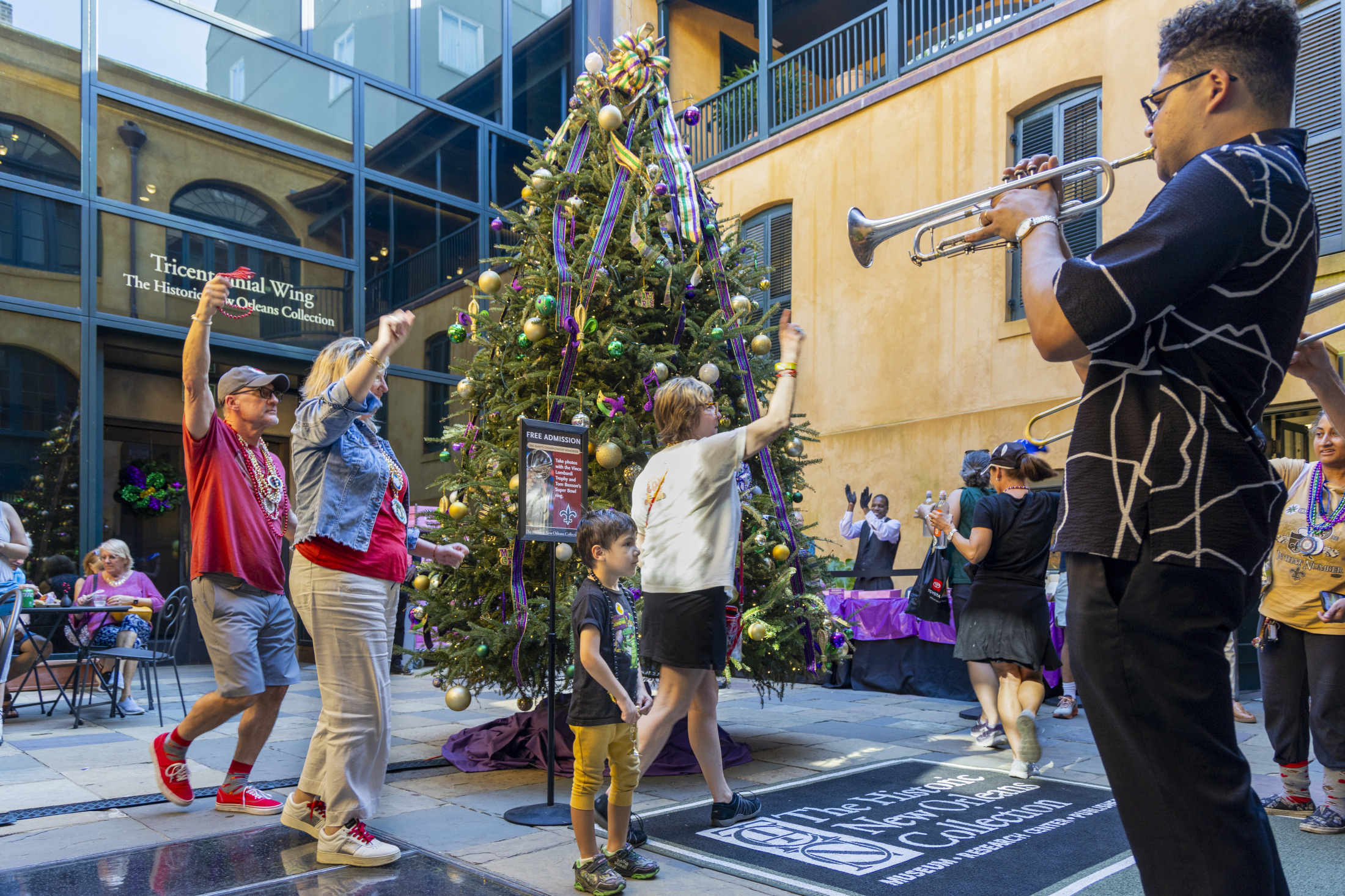 Visitors participate at a Mardi Gras themed event at HNOC.
