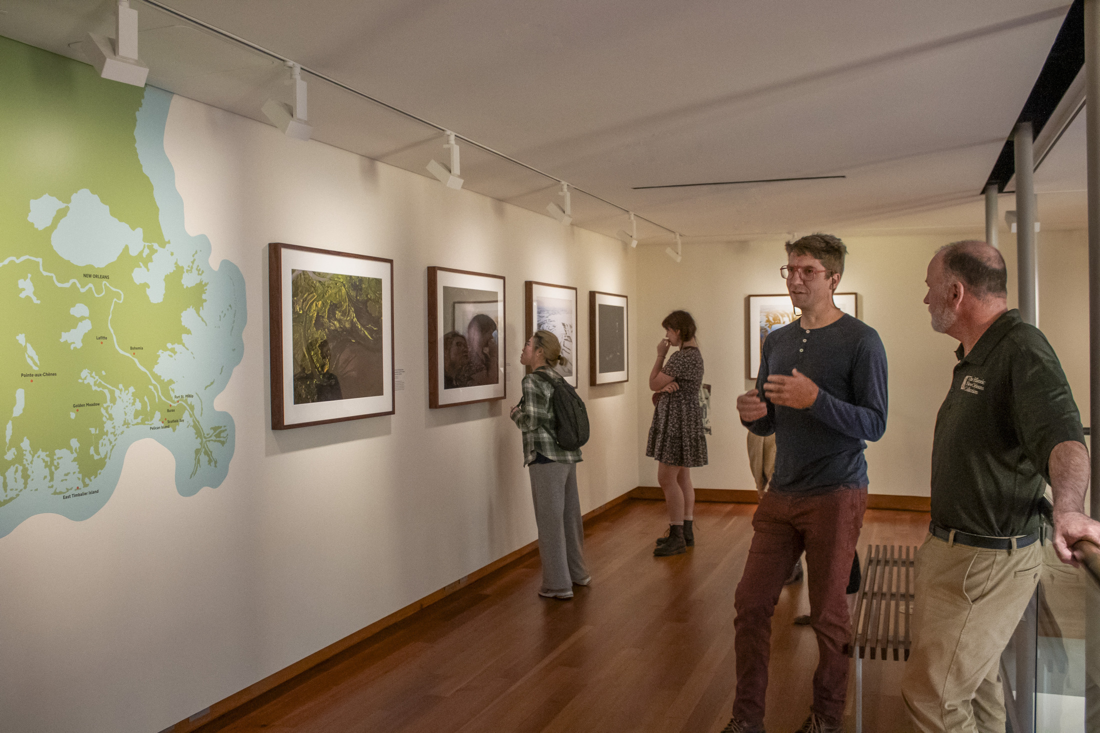 Visitors view photographs on view at HNOC.