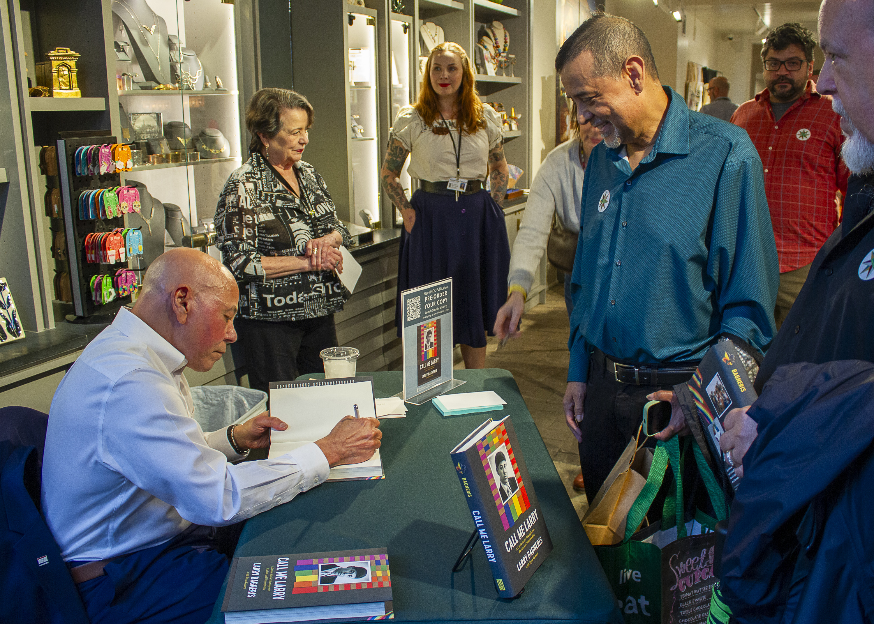 Author Larry Bagneris signs books at the Shop at the Historic New Orleans Collection.