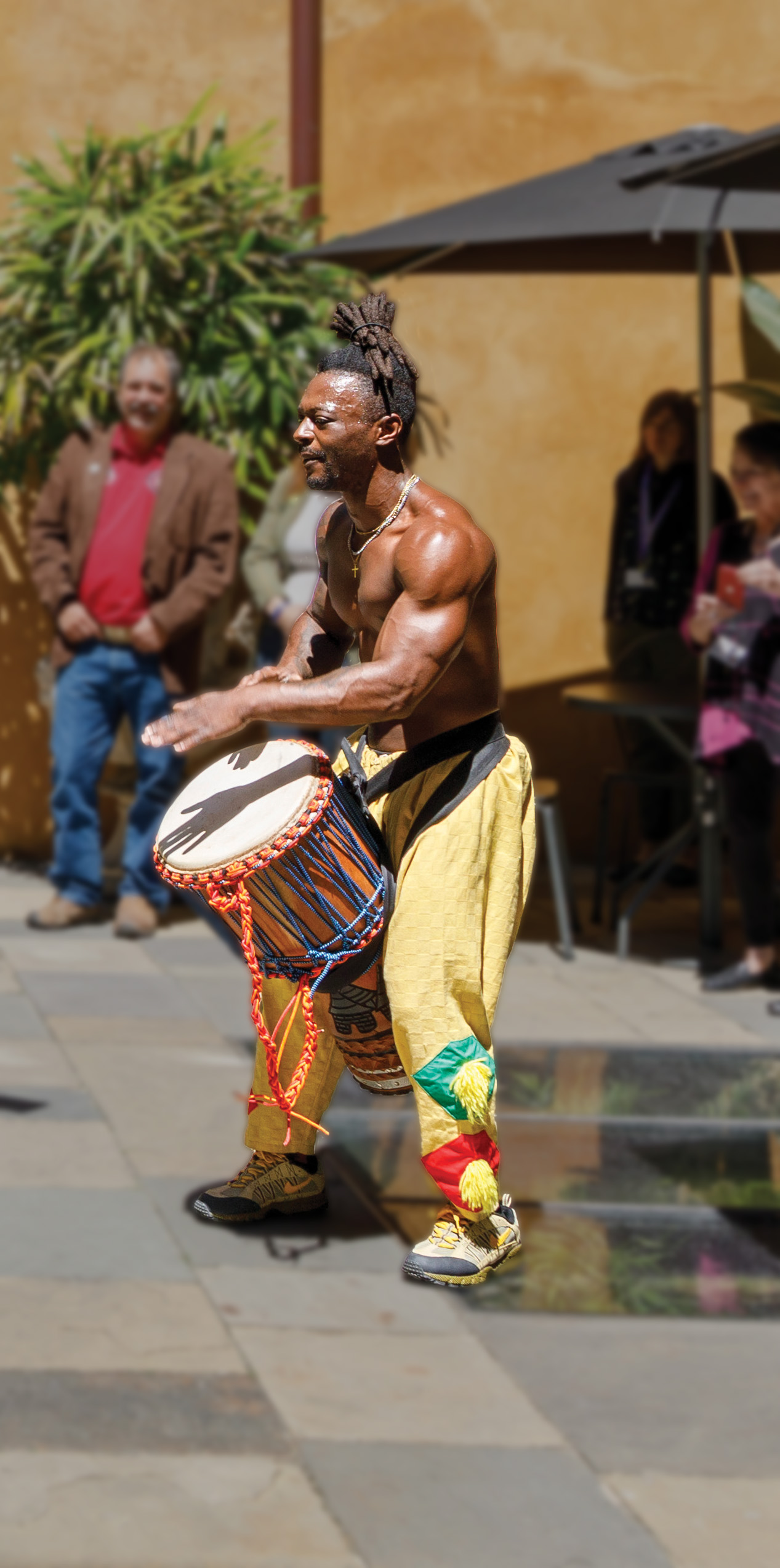 A drummer performs in HNOC’s Brulatour Courtyard.