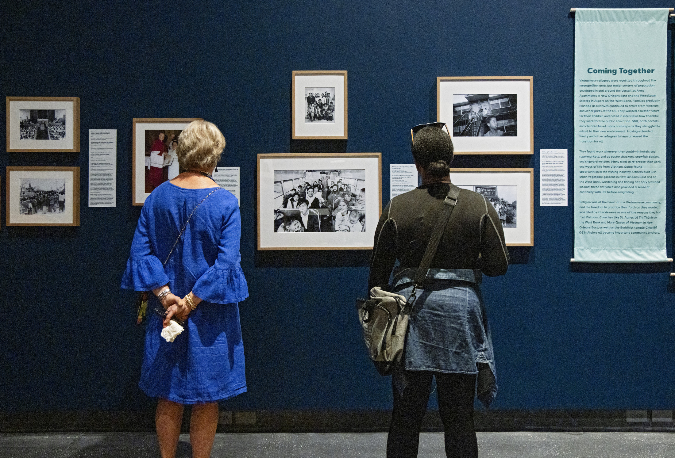 Visitors view an exhibition installation at HNOC.