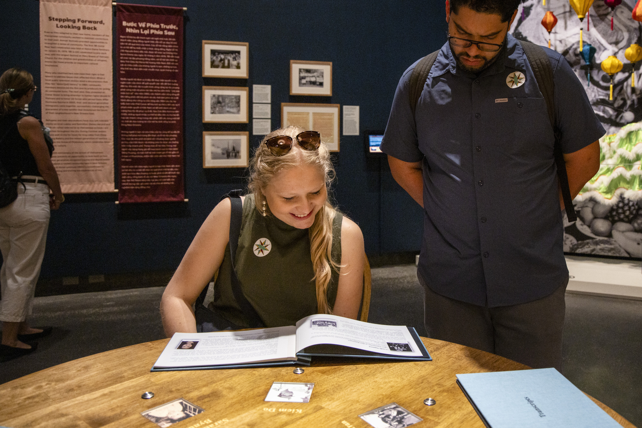 Visitors explore Making It Home: From Vietnam to New Orleans at the Historic New Orleans Collection.