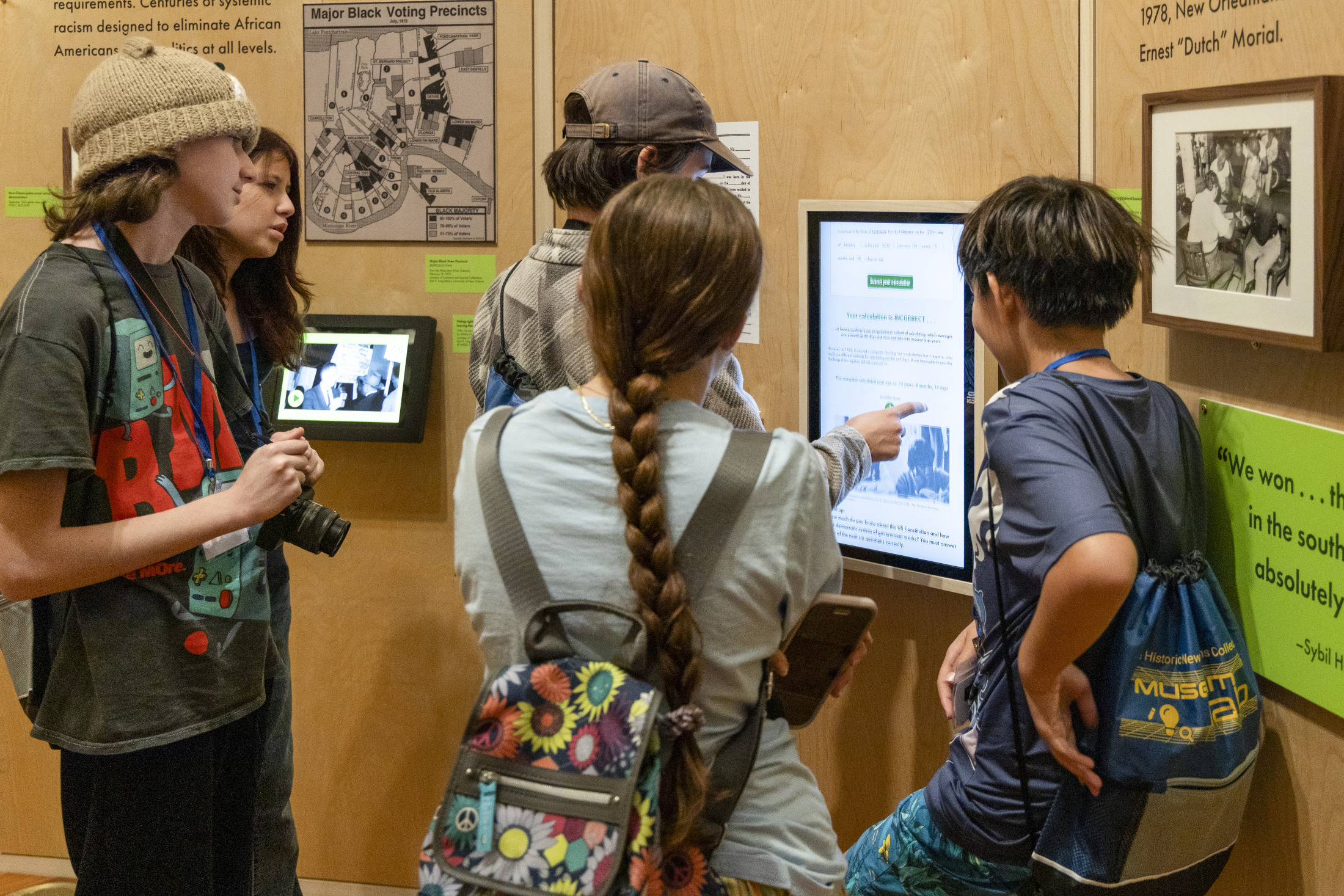 Young people explore an exhibition at the Historic New Orleans Collection.