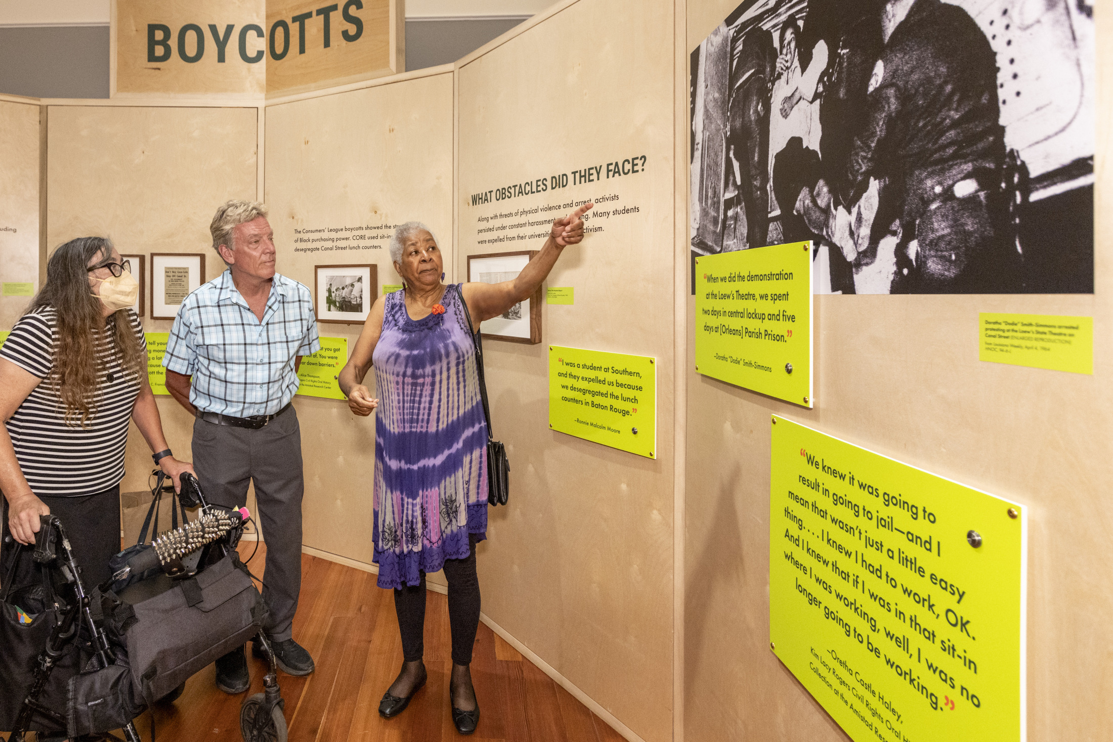 A group of museum visitors explores an exhibition at HNOC.