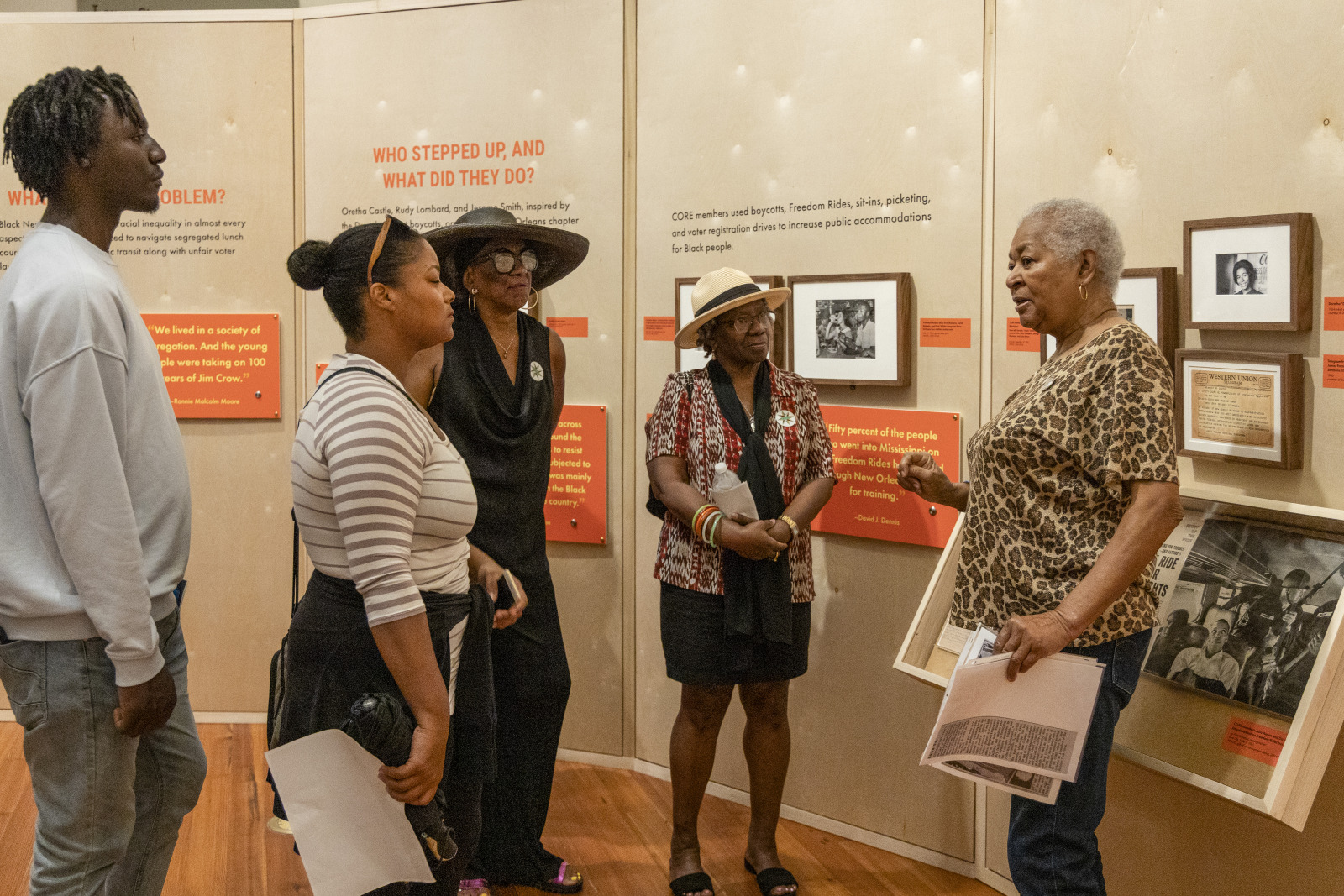 Museum visitors receive a tour of HNOC's "The Trail They Blazed" exhibition.