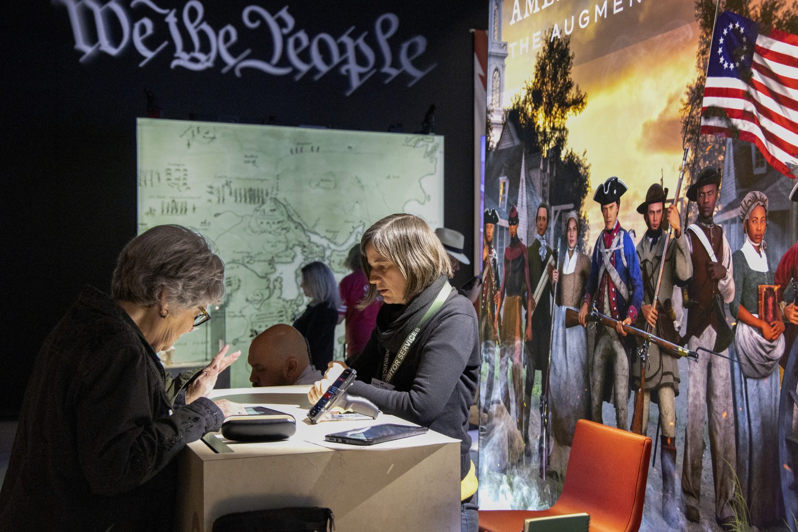 Visitors explore American Revolution: The Augmented Exhibition at the Historic New Orleans Collection.