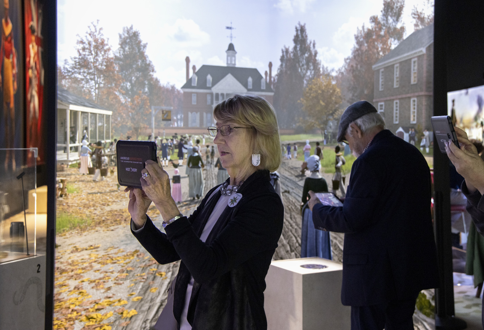 Visitors use HistoPads to explore "American Revolution: The Augmented Exhibition" at HNOC.