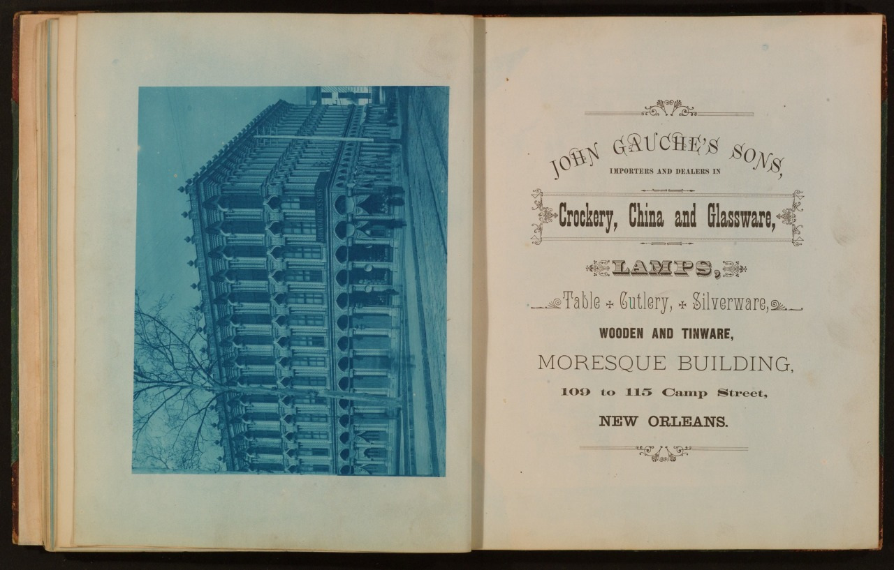 An old advertisement for John Gauches Sons, featuring crockery, china, glassware, lamps, and more, located at the Moresque Building on Camp Street, New Orleans. The left page shows a blue-tinted image of a multi-story building.