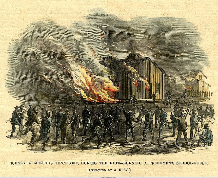 A historical illustration depicts a crowd watching a large fire consuming a building labeled as a Freedmens School-house. Smoke and flames rise as people observe from a distance. The scene is titled Scenes in Memphis, Tennessee, during the Riot.