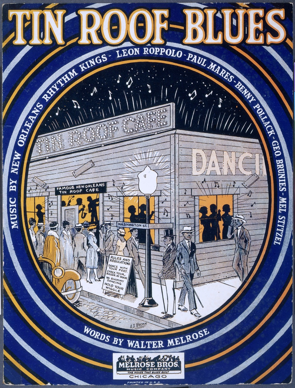 Vintage sheet music cover titled Tin Roof Blues featuring an illustration of a New Orleans street scene with musicians and dancers outside a cafe. The border is decorated with musical notes and stars. Prominent text and artist names are included.