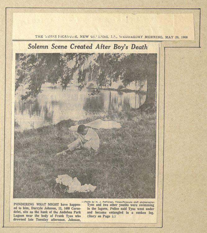 Newspaper clipping with a black-and-white photo of a man sitting by a riverbank, looking at the water. The headline reads, Solemn Scene Created After Boys Death. Text below discusses a boys disappearance and a mans contemplation by the riverside.