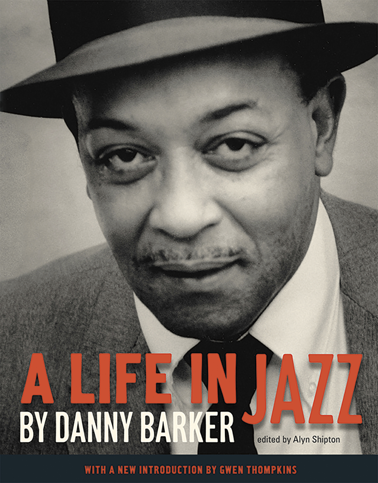 Cover of A Life in Jazz by Danny Barker, edited by Alyn Shipton. The image features a black-and-white portrait of a man wearing a hat and suit. The book includes a new introduction by Gwen Thompkins.