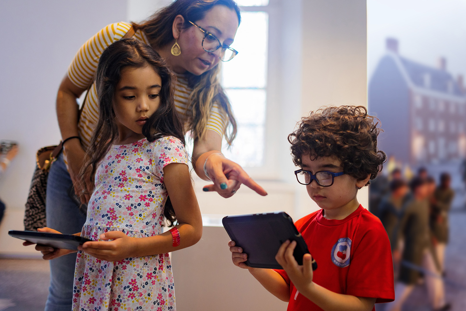 Two children interact with a Histovery exhibition.