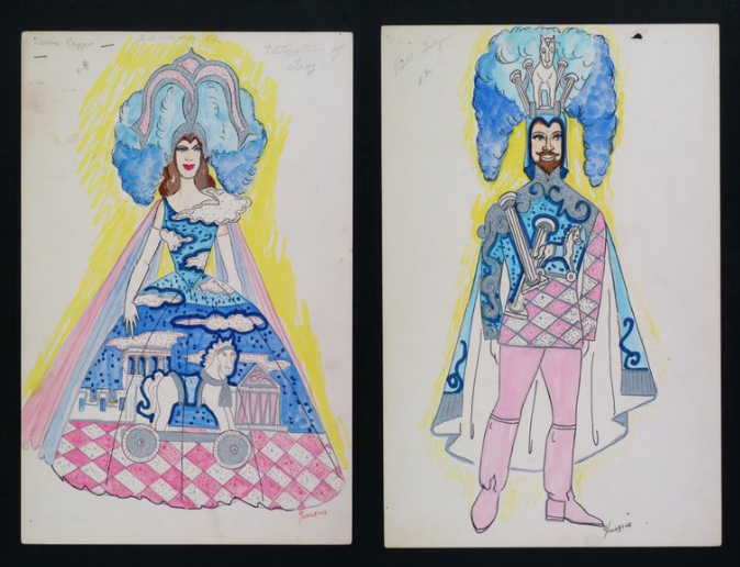 Two illustrated costume designs featuring a woman and a man. Both wear elaborate outfits with blue, pink, and white patterns, including castles and clouds. The woman wears a large headpiece and gown with a carriage motif; the man has a similar headpiece and cape.