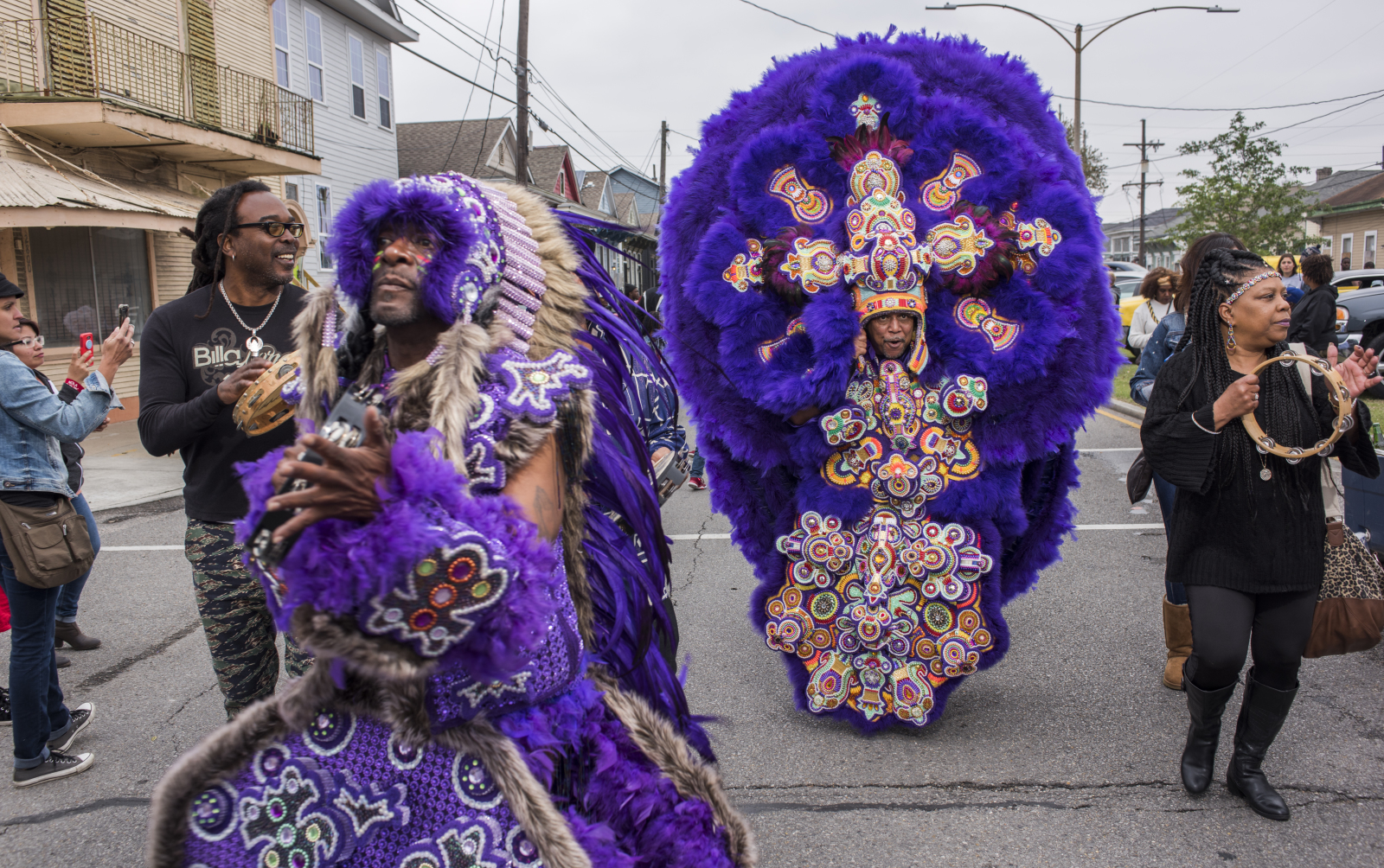 Wildman Larry Terrance and Big Chief Tyron “Pie” Stevenson of the Monogram Hunters parade on Carnival day wearing Mardi Gras suits.
