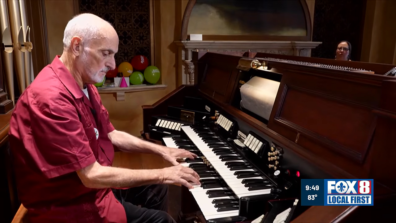 A musician plays an Aeolian Organ at the Historic New Orleans Collection.