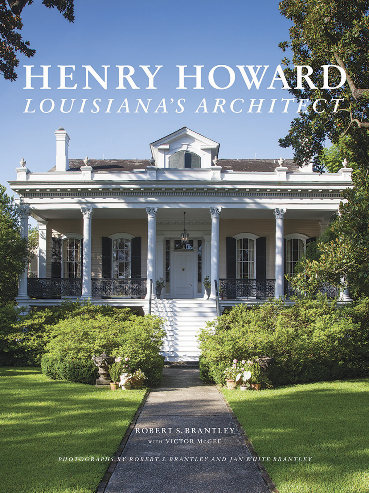Cover of Henry Howard: Louisiana’s Architect by Robert S. Brantley, featuring a historic white mansion with columns and a large porch, surrounded by green trees and a manicured lawn.