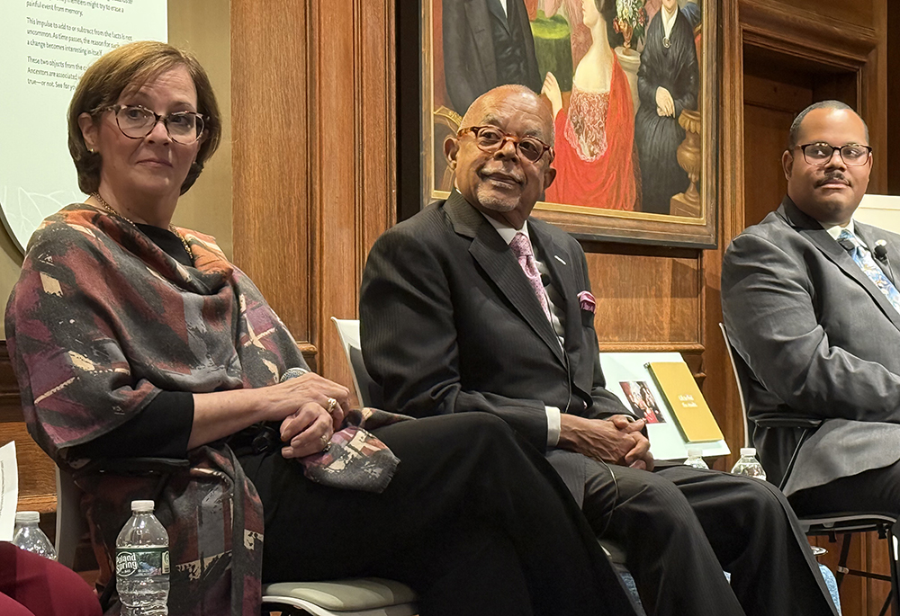 Lourdes Del Pino, Henry Louis Gates Jr., and Jari C. Honora look on during an Oct. 3 panel discussion at the Family Heritage Experience exhibit, at the American Ancestors building in Boston.