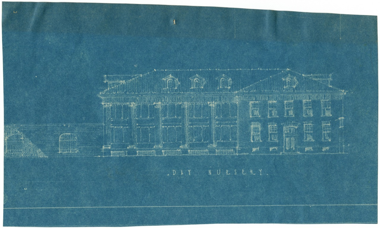 Blueprint of a large two-story building with columns at the entrance and multiple windows. The text Day Nursery is visible below the drawing. The image has a blue background with white outlines.