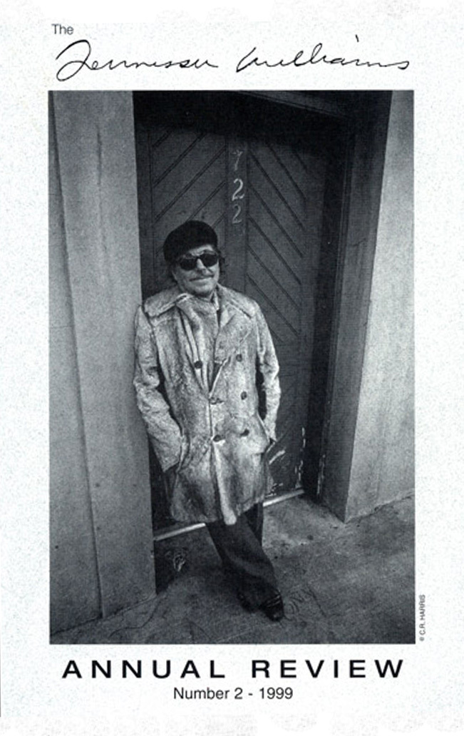 Black and white image of a person leaning against a doorway, wearing a coat, sunglasses, and a hat. The text reads The Tennessee Williams Annual Review Number 2 - 1999.