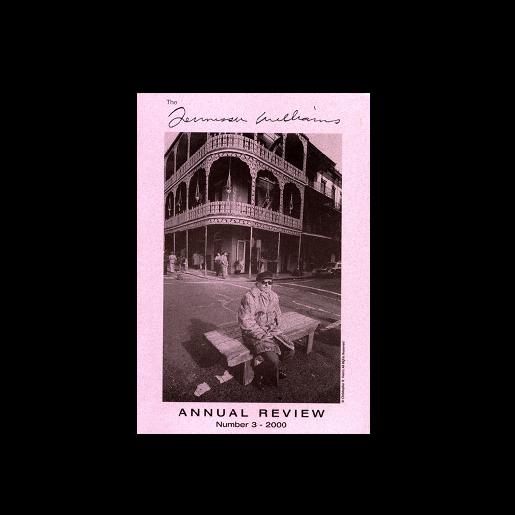 A person sits on a bench in front of a historic building with ornate balconies. The image is on the cover of The Gurner Gardens Annual Review, Number 3 - 2000. The cover has a pink background.
