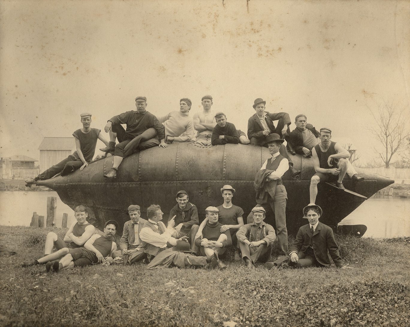 Eighteen men with Civil War submarine, 1895–1905, by Ernest J. Bellocq