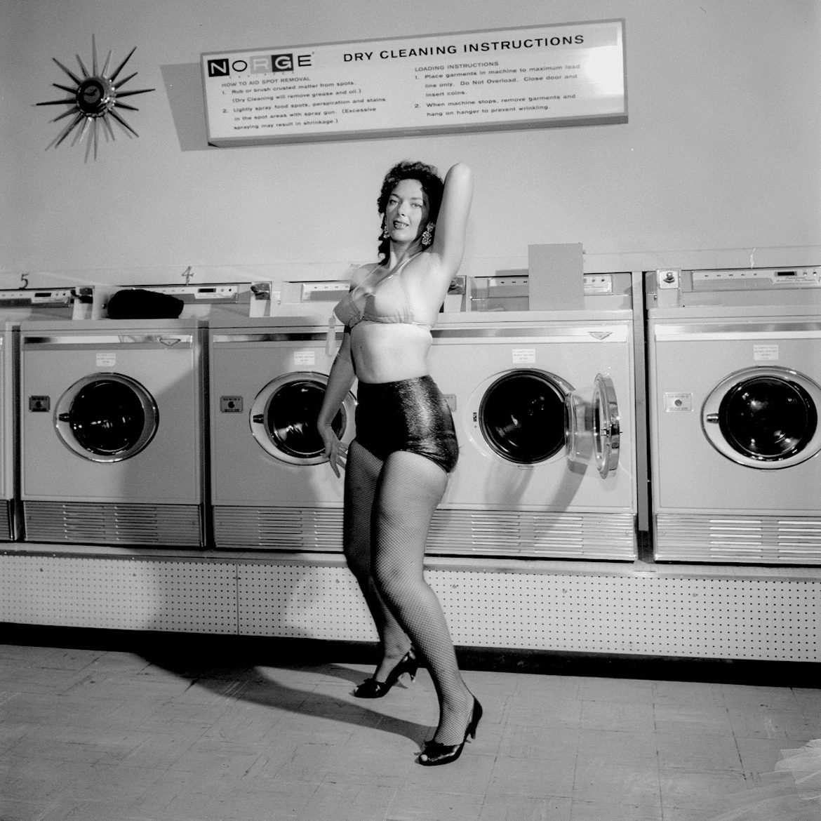 Woman posing in lengerie at dry cleaning business for a Norge Dry Cleaning advertisement