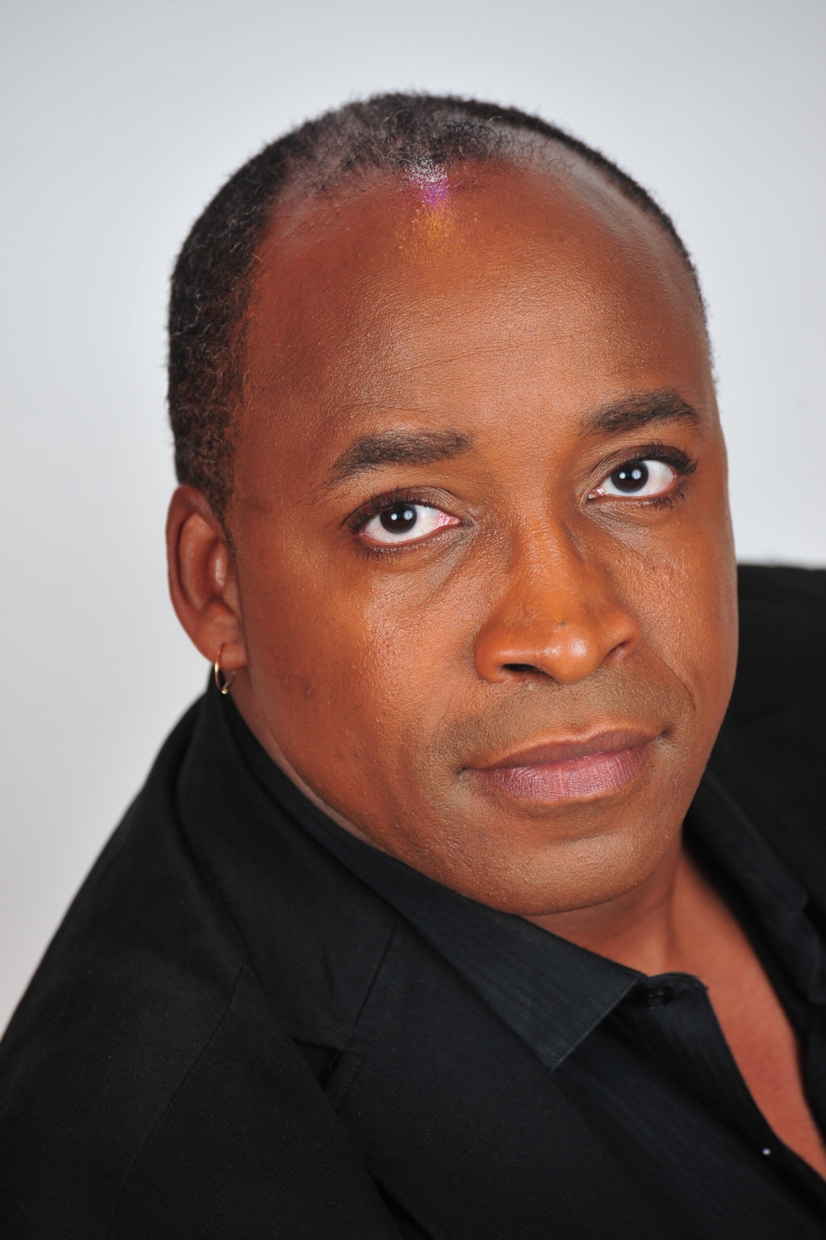Headshot of John “Ray” Proctor