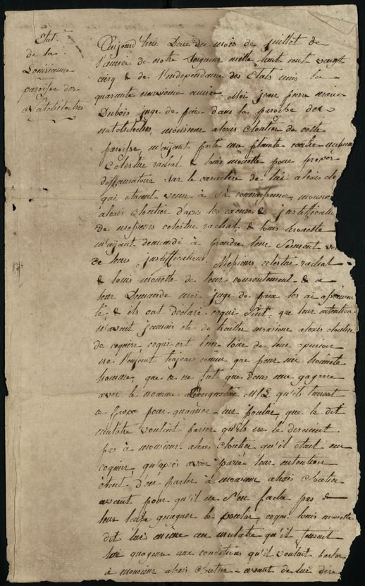 A weathered, handwritten letter on aged paper with torn edges. The cursive text is dense and illegible, showcasing historical or old-style penmanship. The background is dark, highlighting the faded and yellowed texture of the paper.