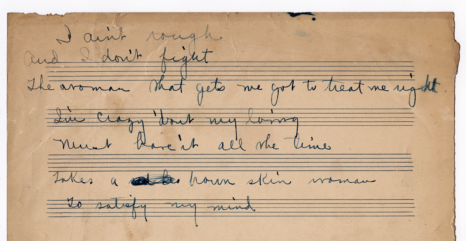 A photograph of a piece of old staff paper shows Louis Armstrong's cursive handwriting.