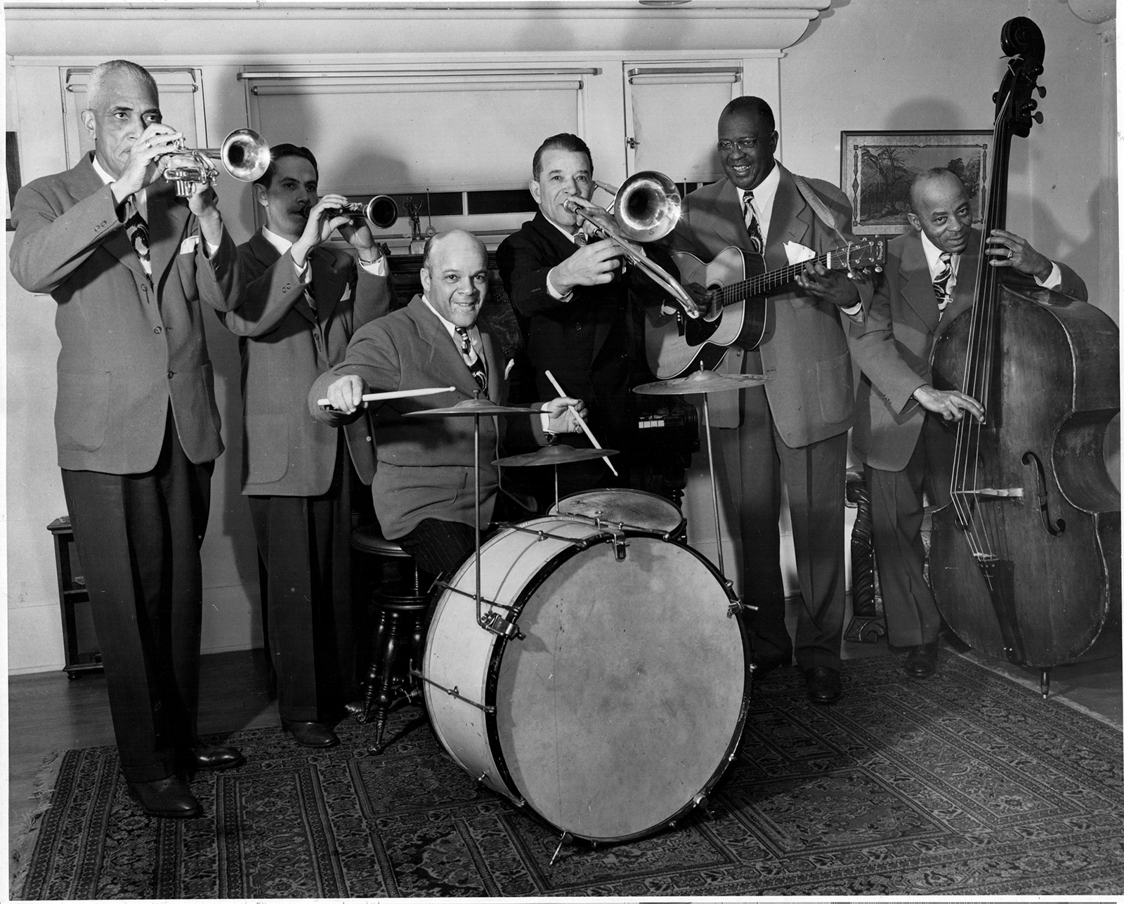 A vintage black and white photo of Kid Ory’s Creole Jazz Band, taken at Ory’s home on Arlington Avenue in Los Angeles in 1947.