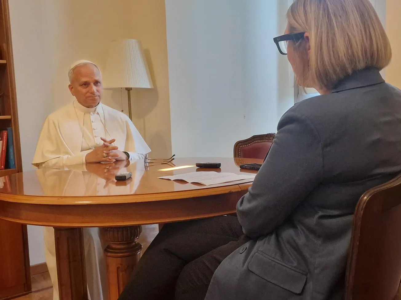 Pope Leo XIV speaks with author Elise Ann Allen from Crux Magazine during an interview in July 2025.