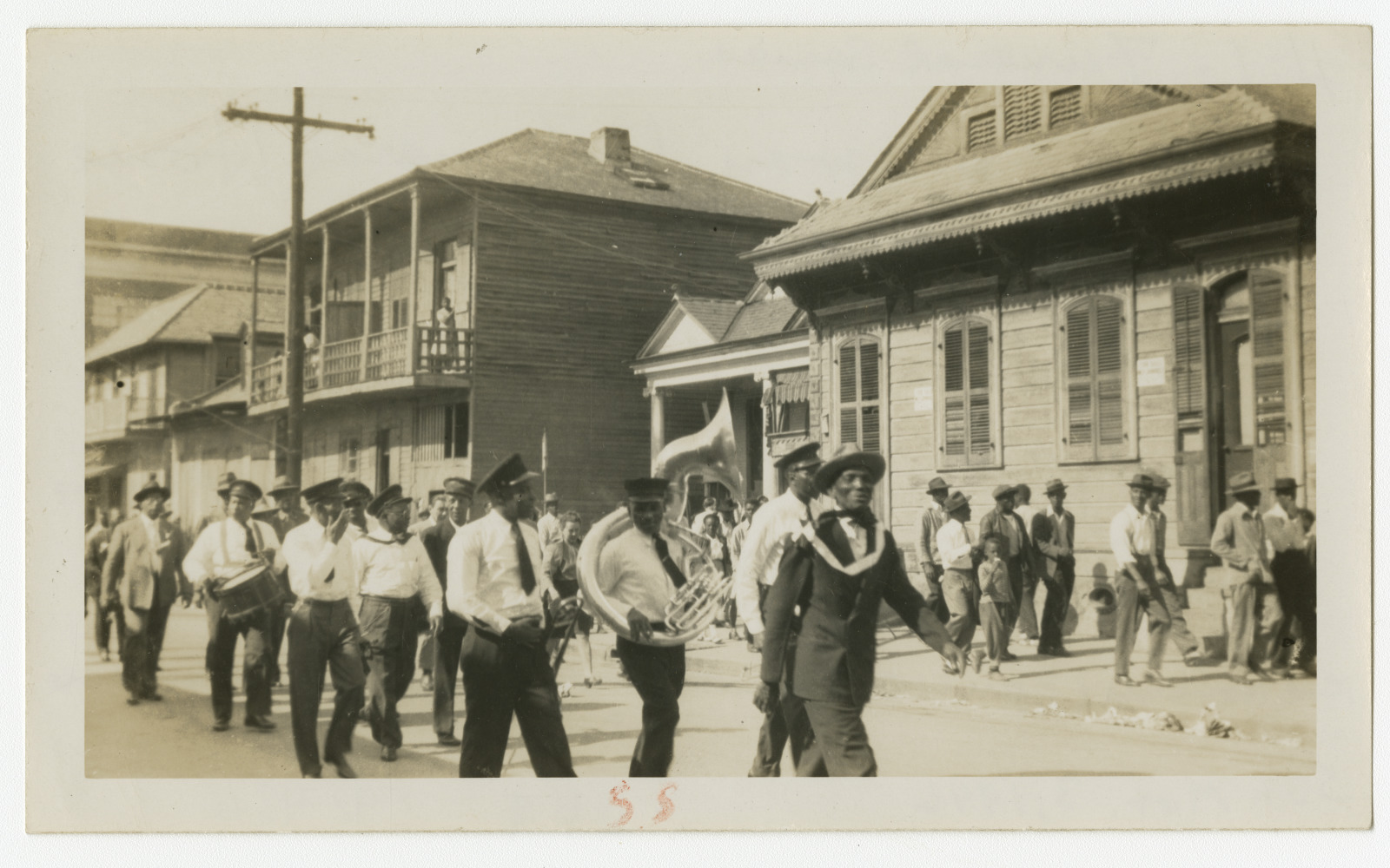 Members of the Square Deal Boys march through Tremé with a funeral in 1946.