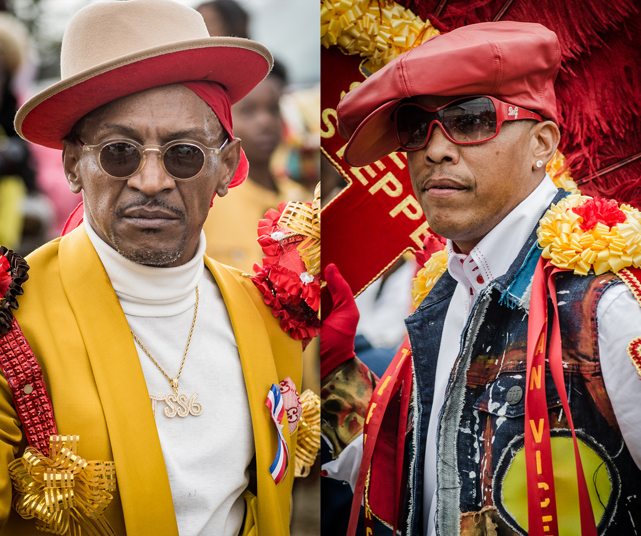 Two men dressed in vibrant attire each feature distinctive accessories. On the left, a man wears a mustard jacket, adorned with ribbons and a hat. On the right, a man sports sunglasses, a denim vest, and a red hat, both with colorful embellishments.