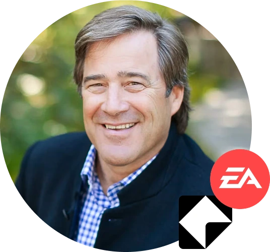 Circular avatar: smiling man, navy jacket, blue‑checked shirt, blurred green bg. Overlays: red EA badge lower-right; black square with white up‑left arrow.