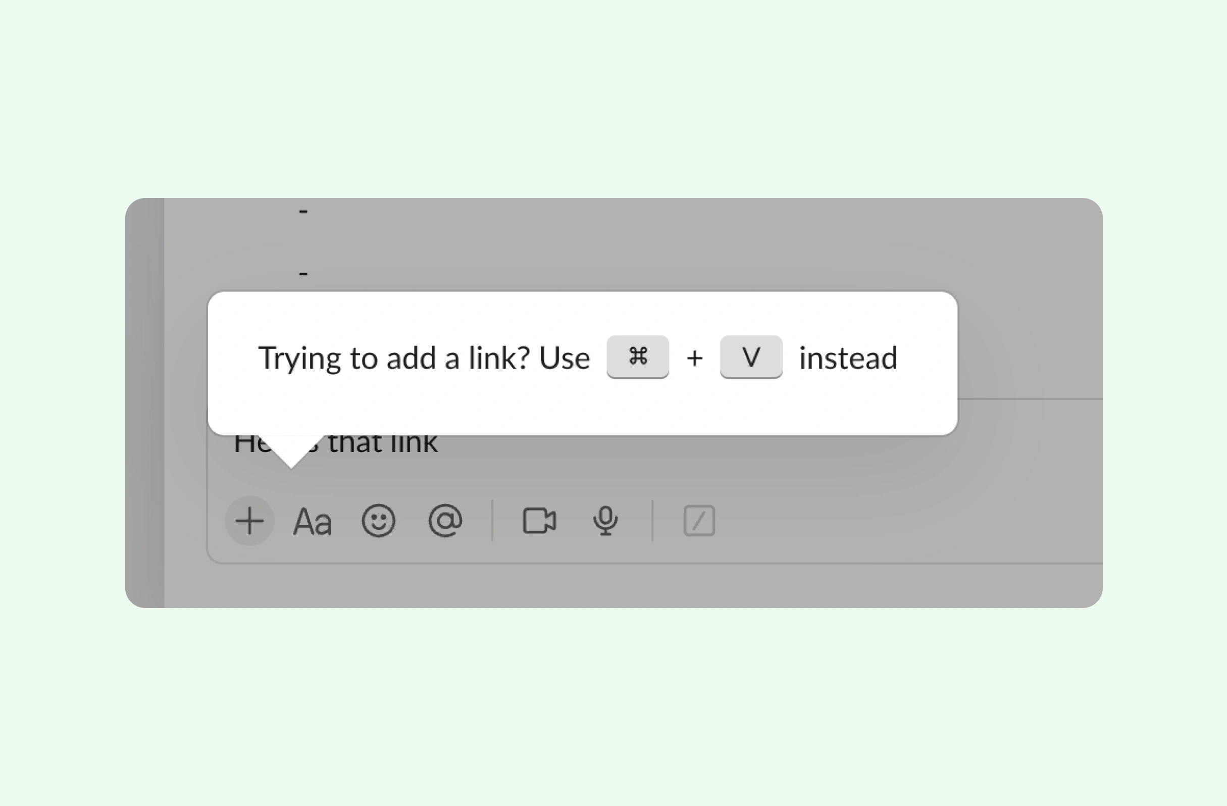Slack message input UI with toolbar icons (plus, Aa, emoji, @, video, mic). Tooltip prompt says "Trying to add a link? Use ⌘ + V instead".