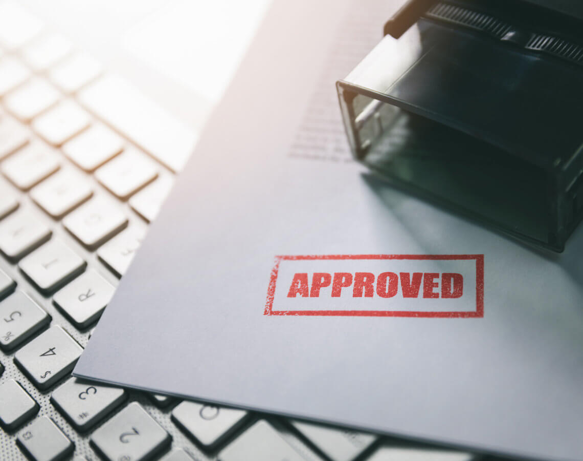Paper document stamped with Approved
