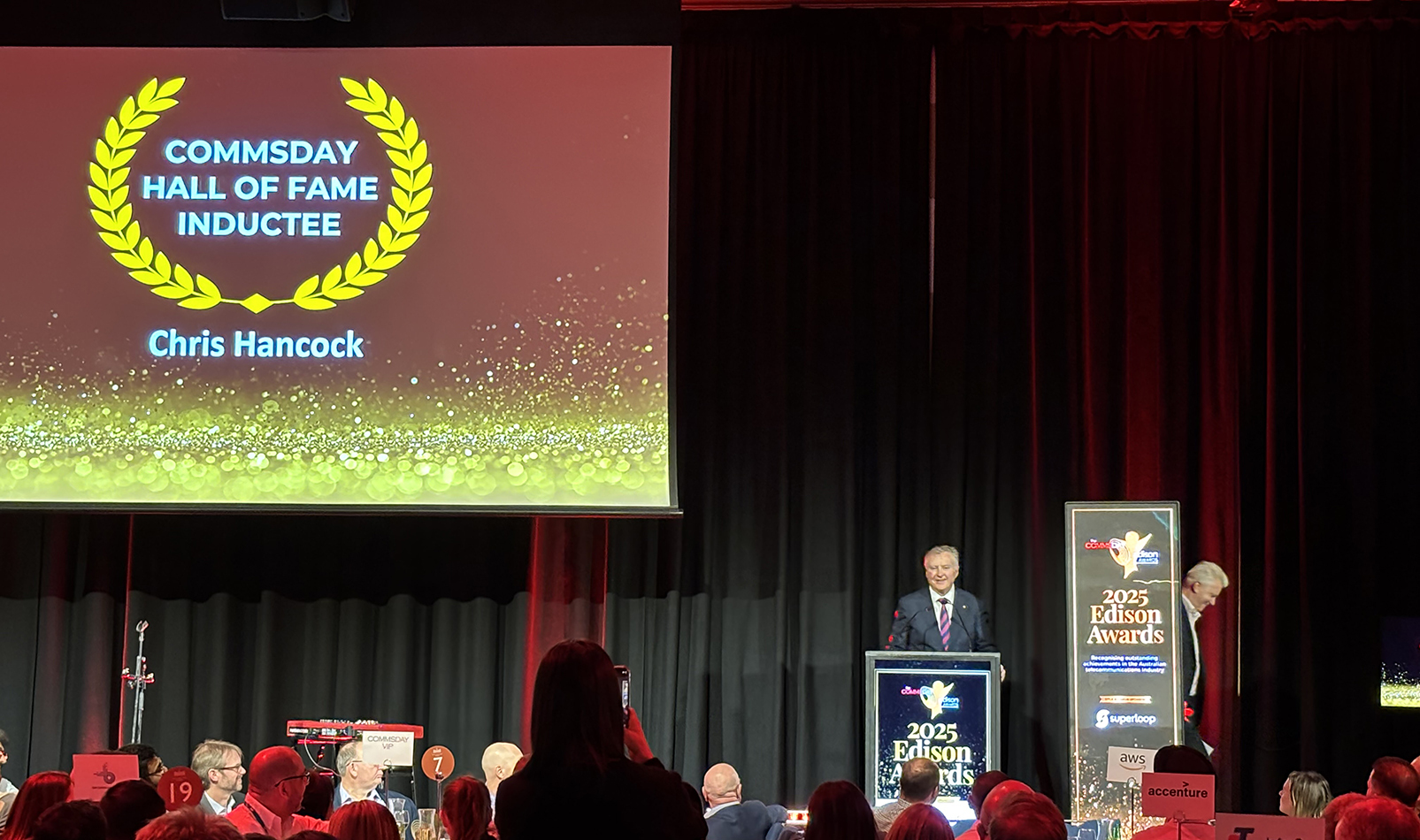AARNet CEO Chris Hancock AM being inducted into the Communications Day (CommsDay) Hall Of Fame in June 2025
