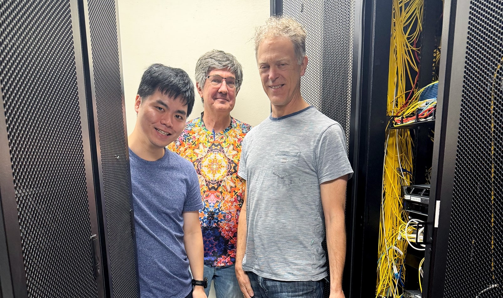 The teams from AARNet, NMI, and UTS with an atomic clock.