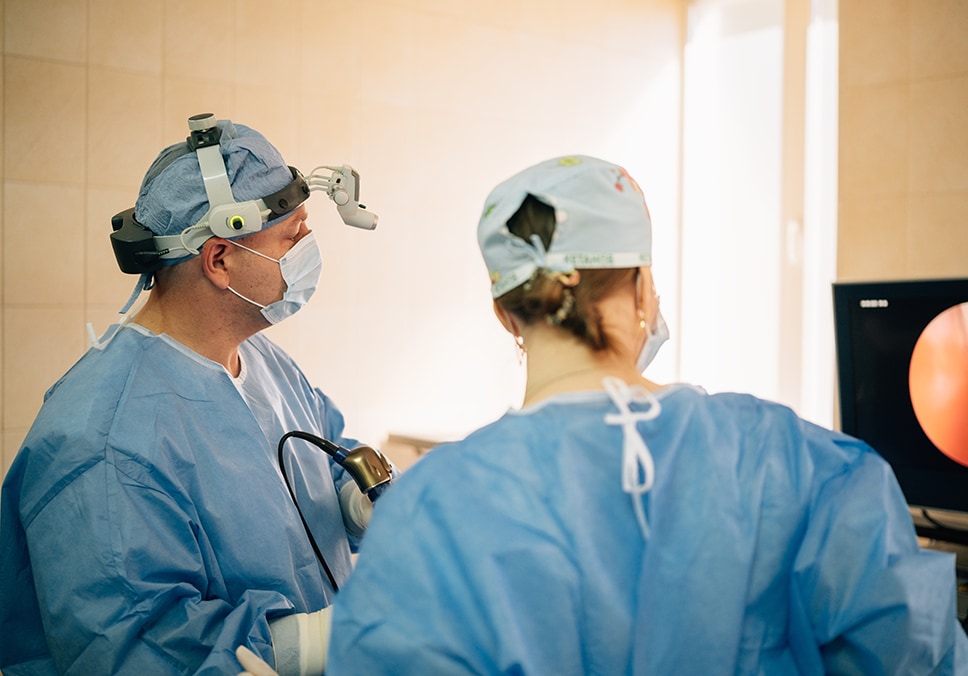 Doctors performing an endoscope procedure using a monitor