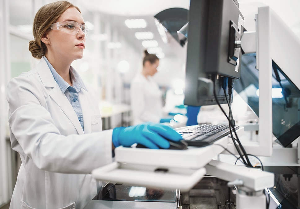 Researchers working in laboratory computer