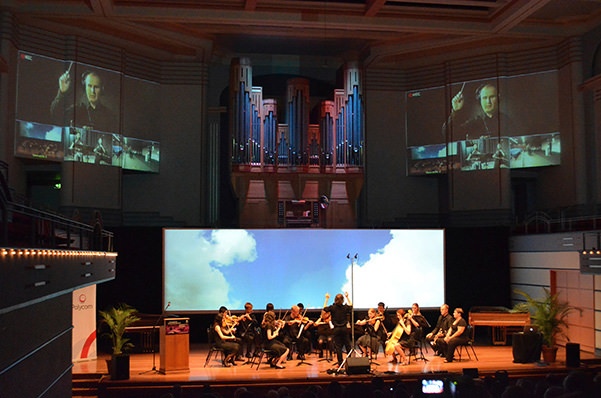 Synchronising musicians across the globe - Spacetime Concerto