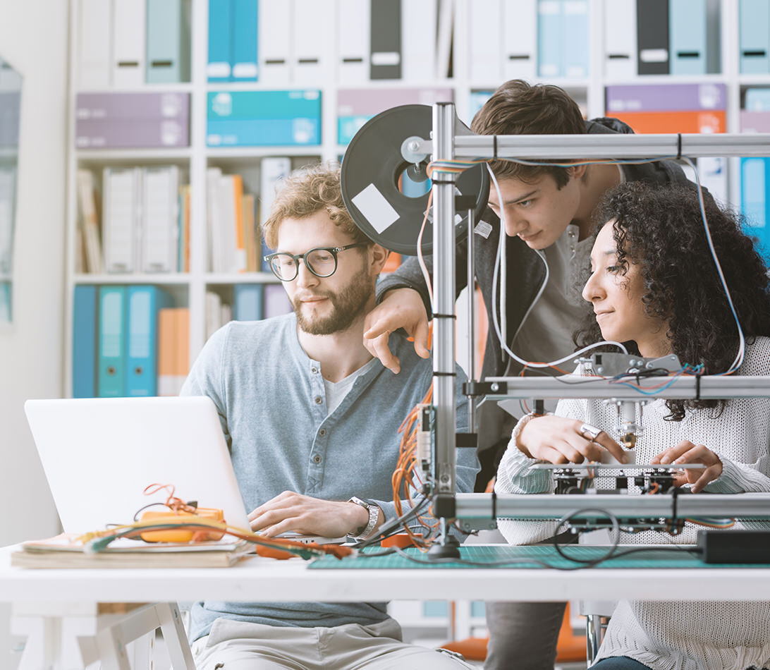 Students studying robotics and 3D printing