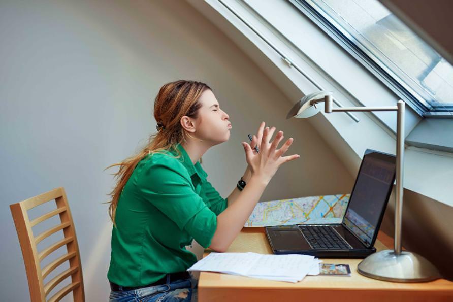 Woman frustrated at laptop