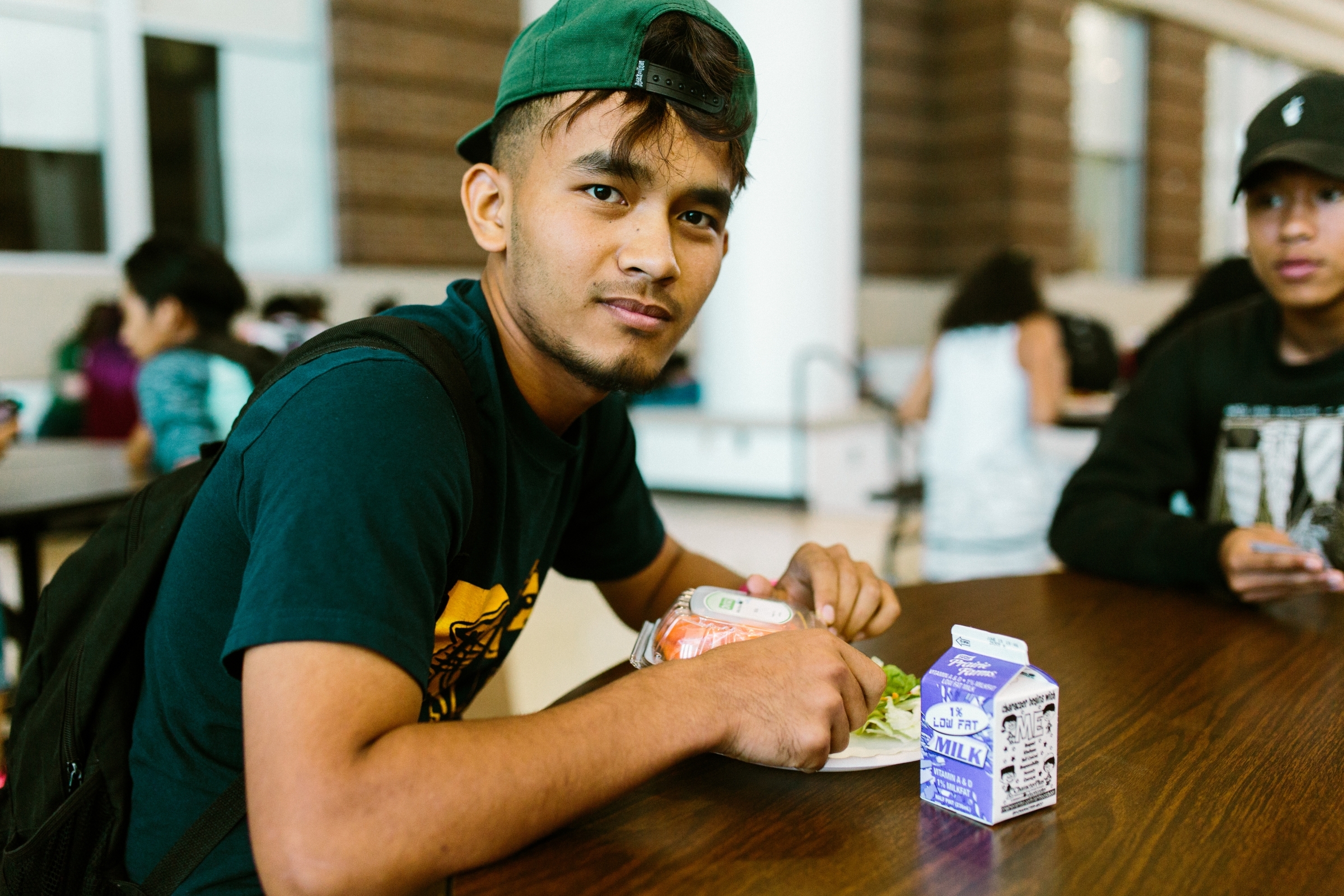 Student eating lunch in the cafeteria