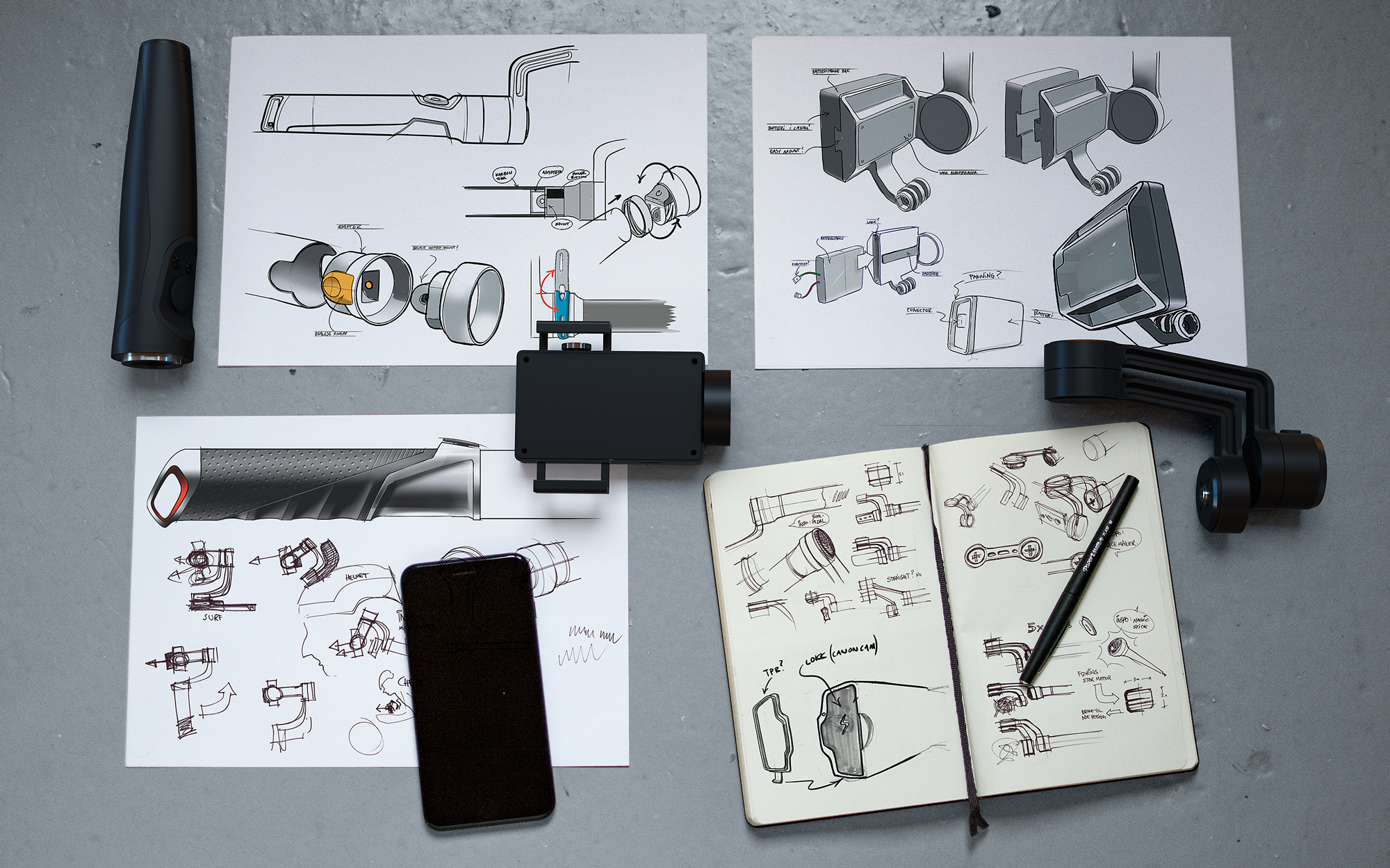 Tekniske håndskisser og prototyper utover et bord.