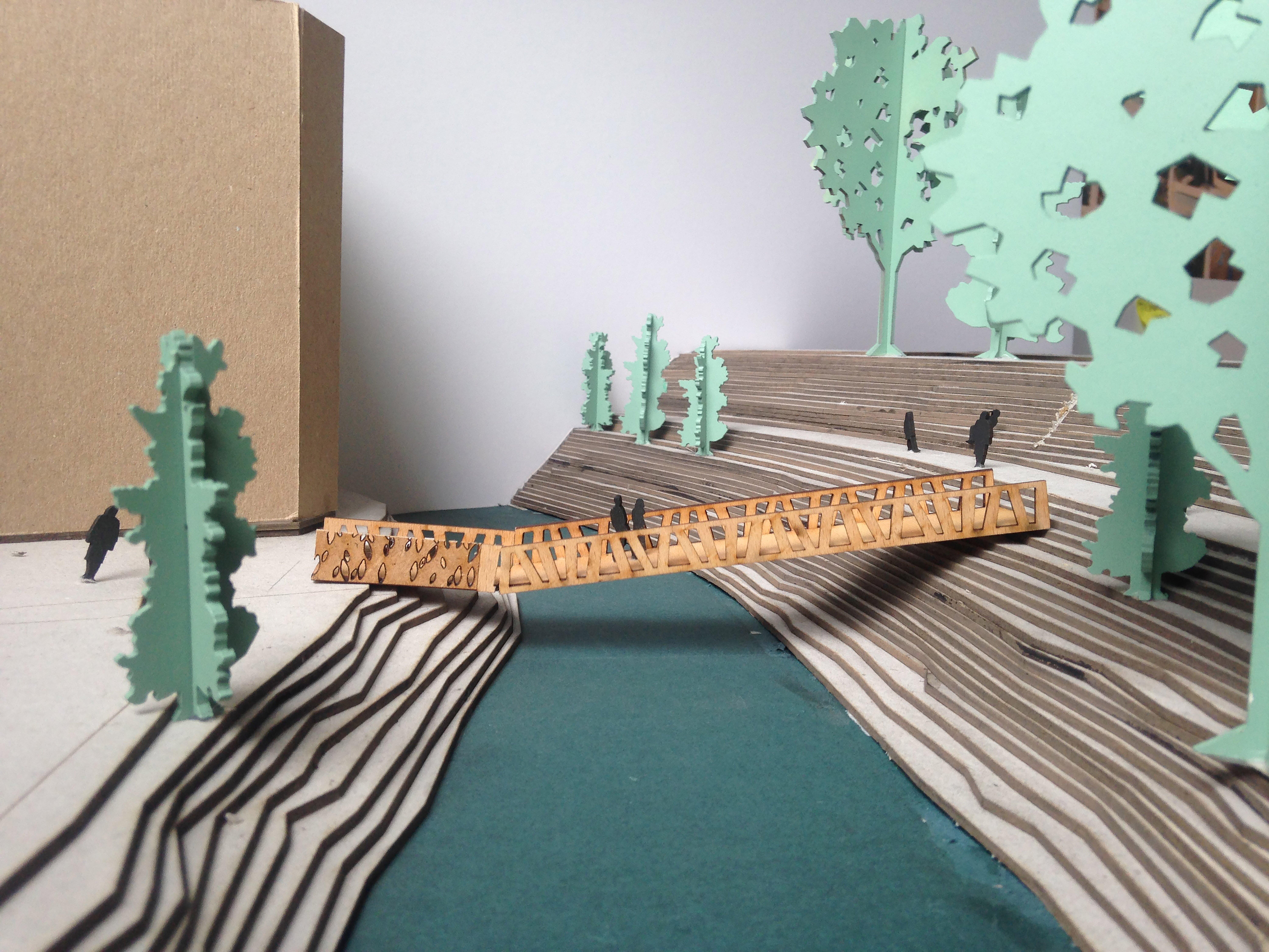 En skissemodell av broen i landskapet. Utført i laserkuttet treverk.